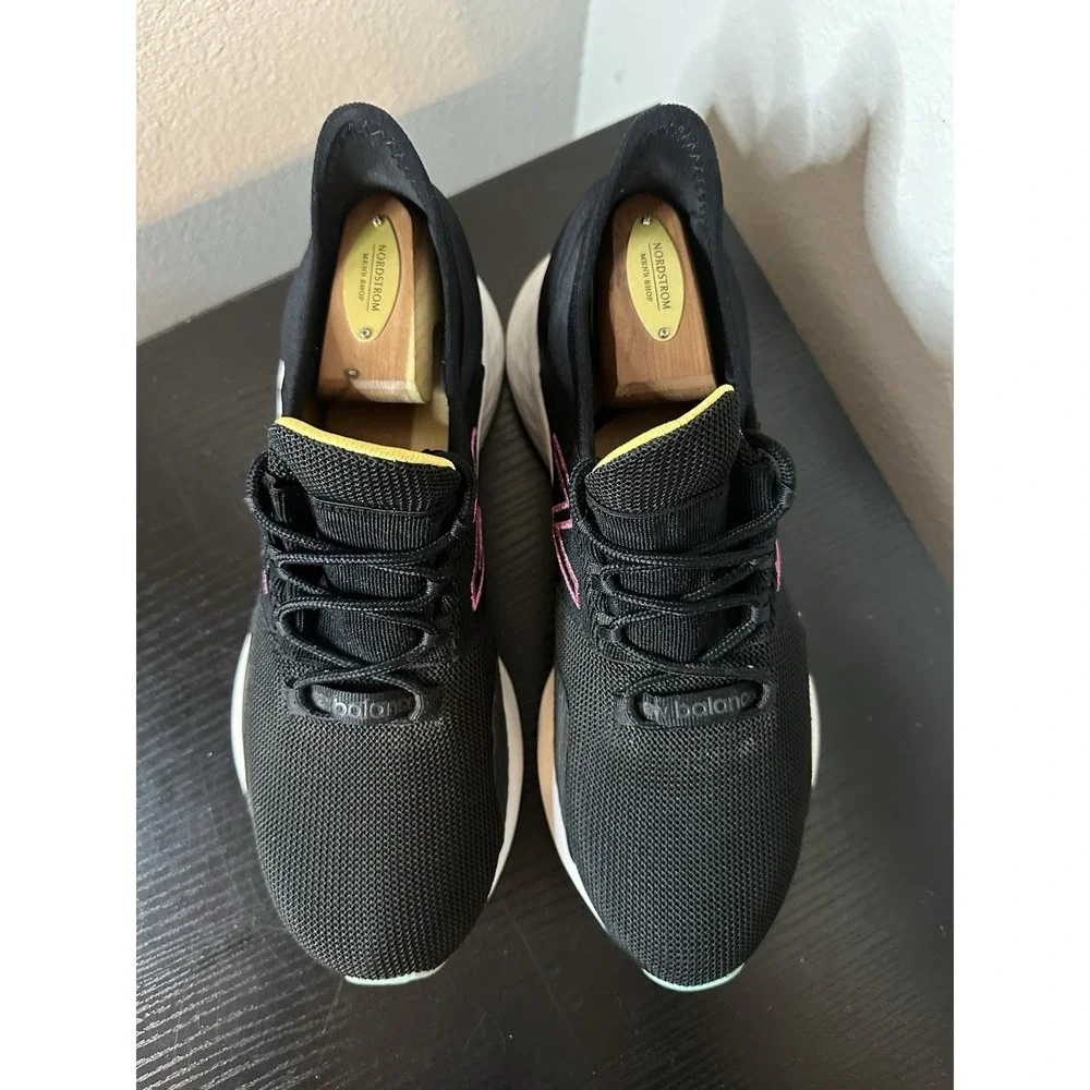New Balance Black Athletic Sneakers with Pink and Yellow Accents